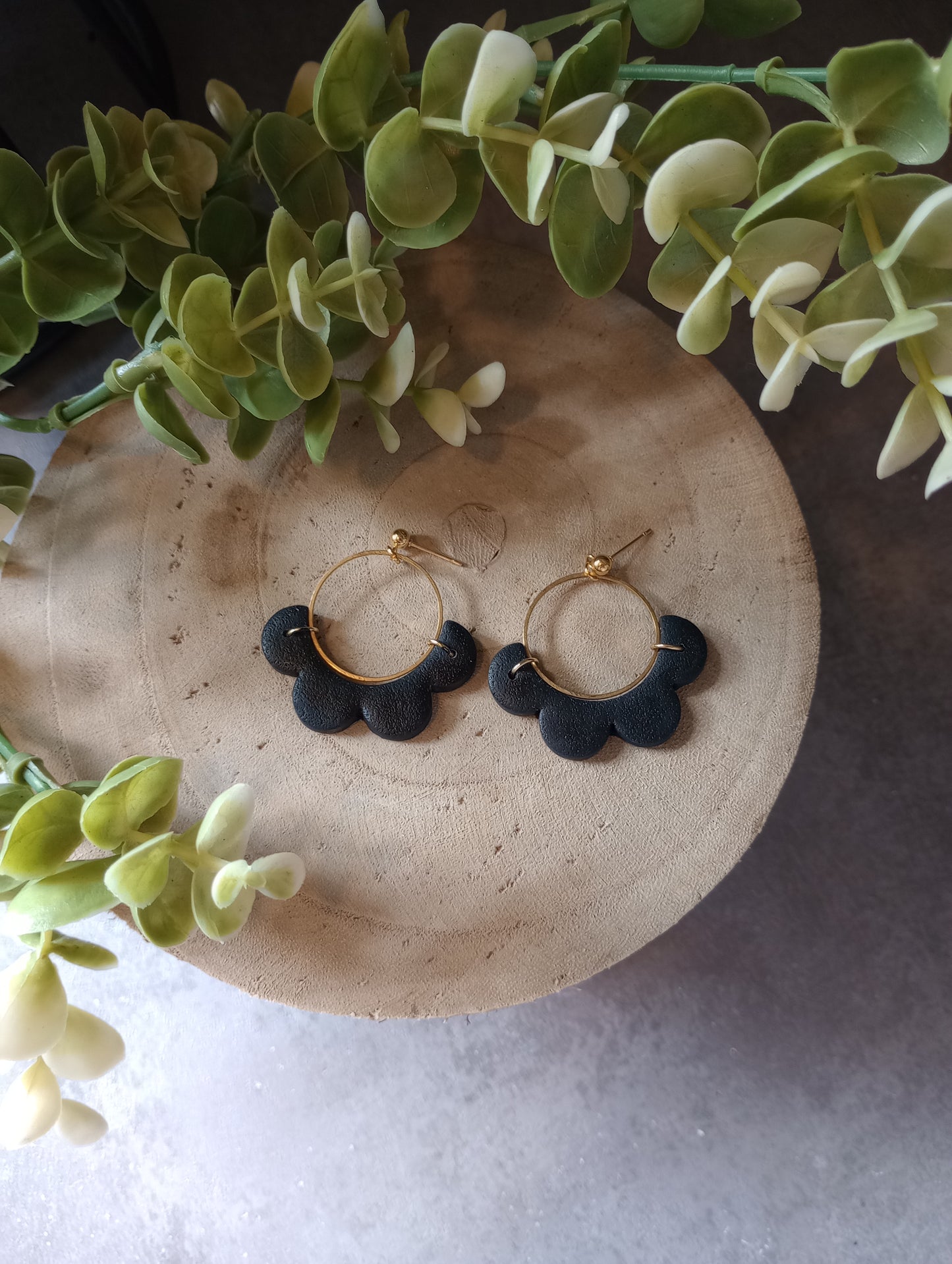 Black floral circle earrings